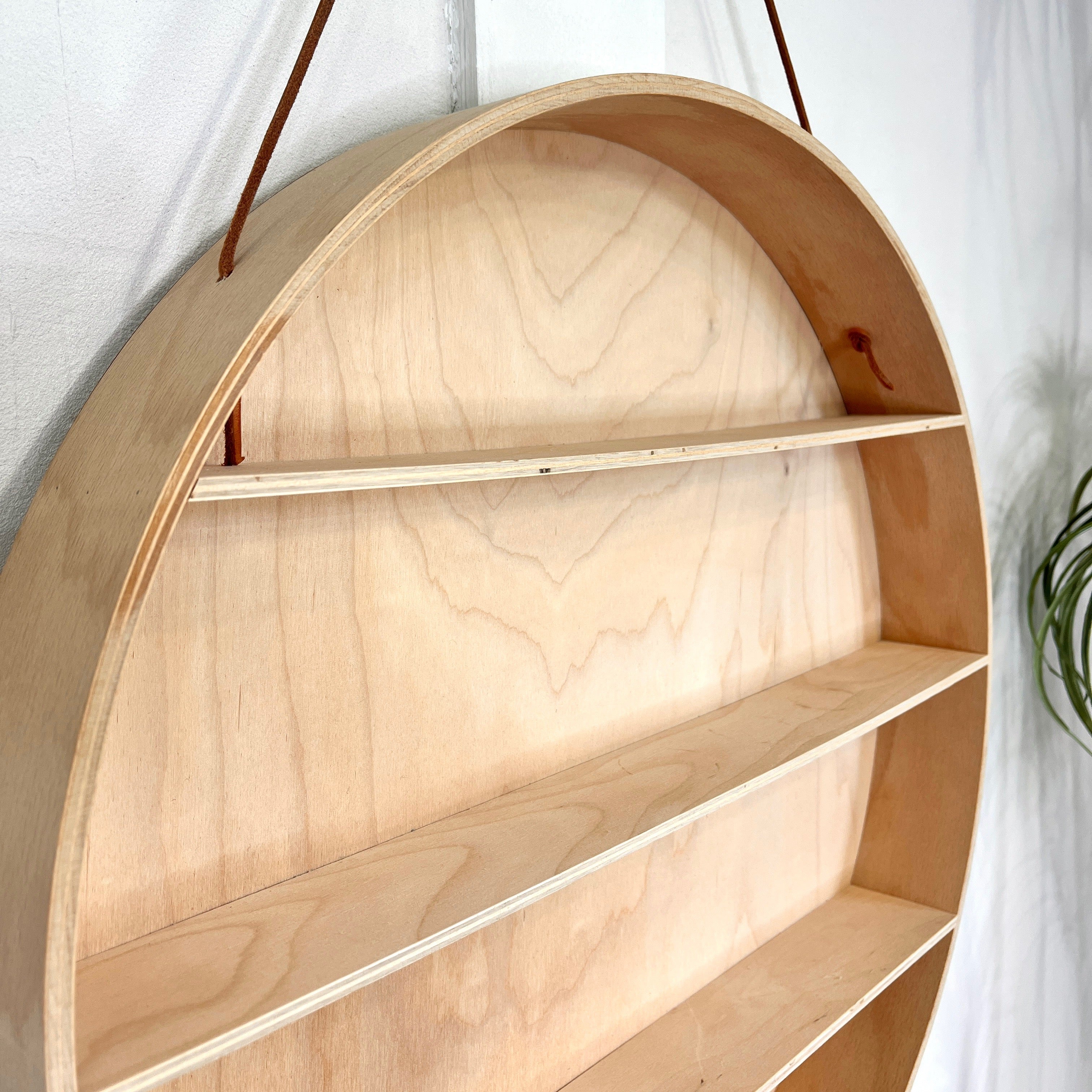 Give your wall a unique look with a round wooden shelf